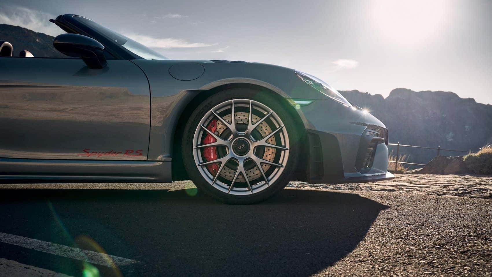 dark silver Porsche in sunlight